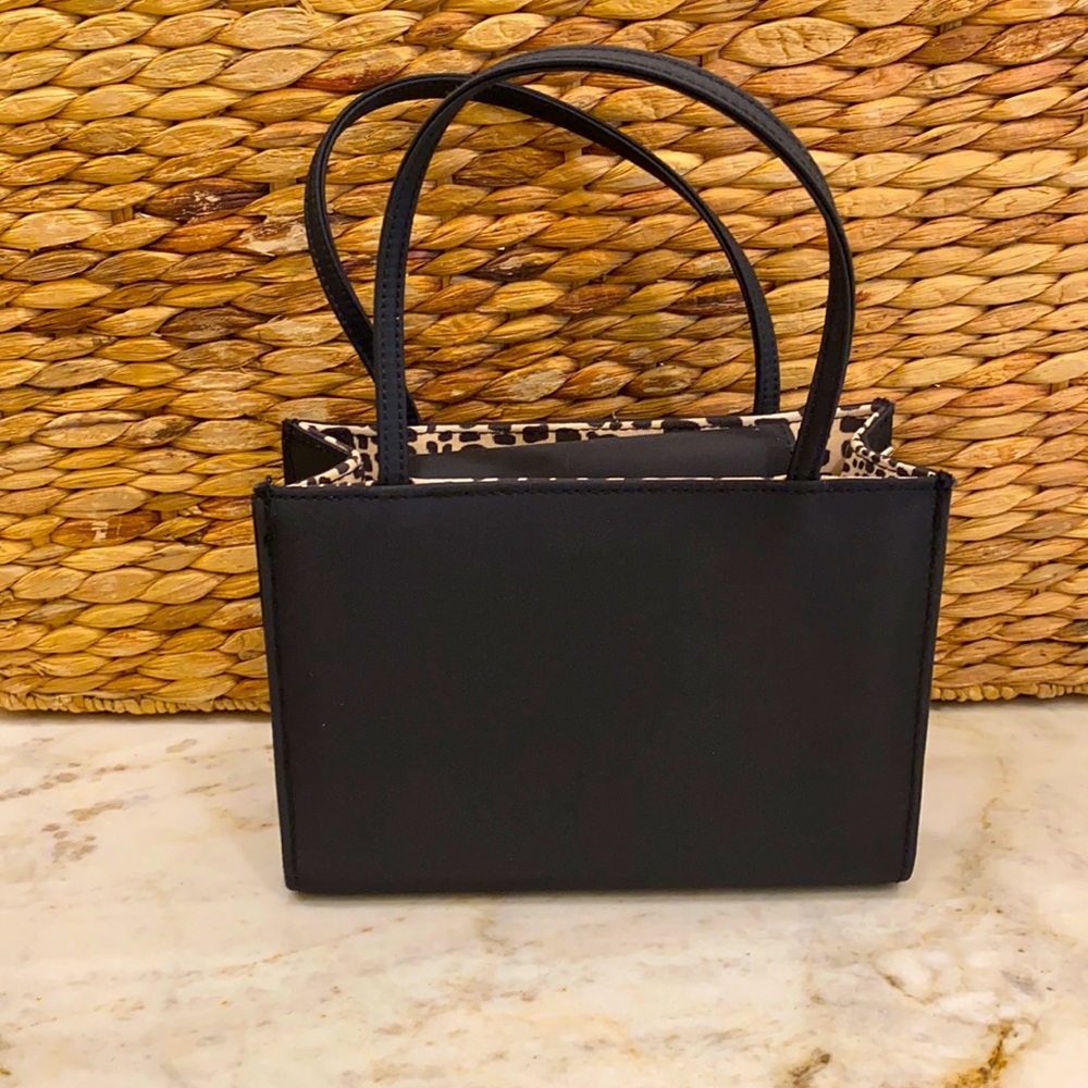 Silky black tote with detachable shoulder strap.